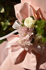 beautiful white ribbon bow on bouquet wrapper as a decoration 