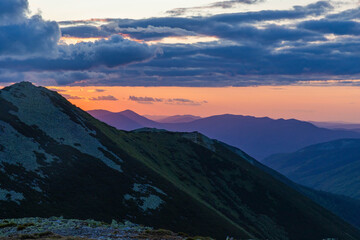 An incredibly beautiful sunset on the top of Mala Syvulya Mountain in the Carpathians