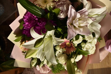 stunning bouquet: white roses, gerberas and lily bud top view	