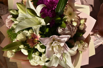 stunning bouquet: white roses, gerberas and lily bud top view	