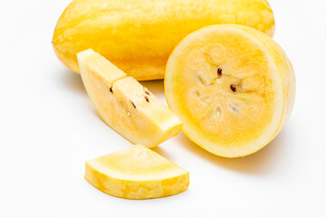 Yellow Watermelon Cut into Pieces on White Background