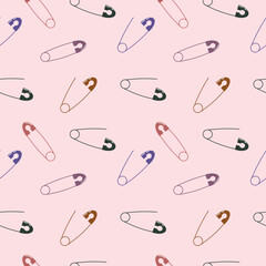 Seamless pattern of multicolored safety pins on soft pink background with a mix of open and closed designs arranged in a diagonal layout