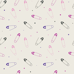 Seamless pattern featuring black, pink, and purple safety pins with small colorful dots on a light cream background in a minimal style