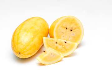 Yellow Watermelon Cut into Pieces on White Background
