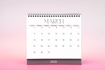 Desktop monthly calendar for March 2026 on pink color background.
