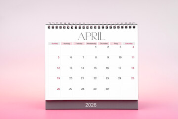 Desktop monthly calendar for April 2026 on pink color background.
