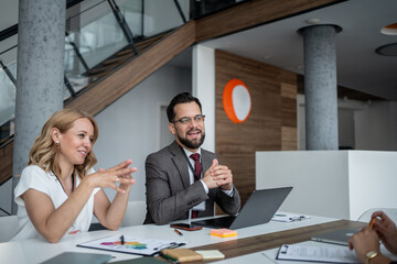 Business people collaborating during corporate meeting in modern office
