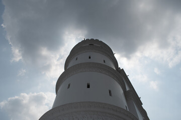 clock tower of hoogly imambara with cloudy sky background at hoogly, west bengal, india