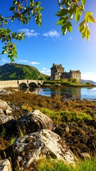 Scottish castle by the water, sunlit