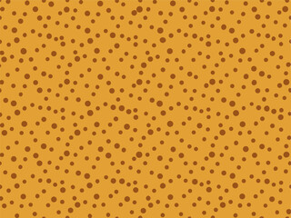 Vector background or pattern of random brown dots on a warm yellow surface.