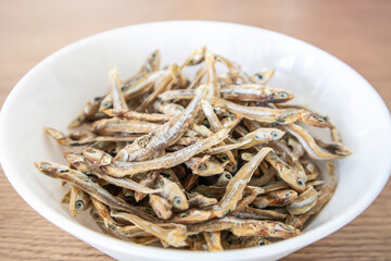 A bowl of dried anchovy fish. Side dish. Fish dish, seafood