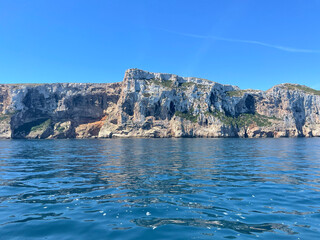 Rocky coastline with crystal clear blue sea