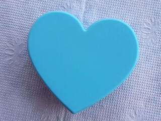 Top view  a large single heart shapes design valentine's day concept for stock photo. design blue hearts isolated on white texture background, symbol