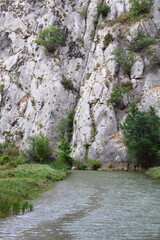 Gorge and River Landscape A Picturesque View of Rocky Cliffs and Water