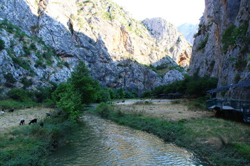 River flowing through a rocky canyon with a wooden walkway. Incesu canyon,Corum,Turkey