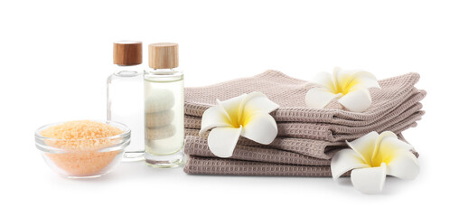 Spa composition with waffle towels and cosmetic products isolated on white