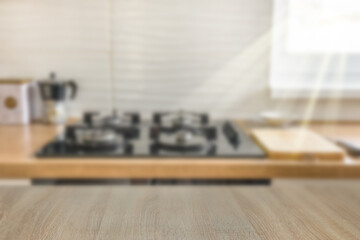Wooden  table top on blur kitchen counter room background
