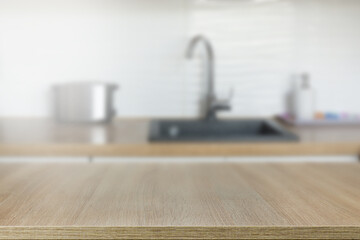 Wooden  table top on blur kitchen counter room background