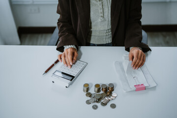 Bill pay. Online internet banking asian young woman hand using calculator for calculate expense to...