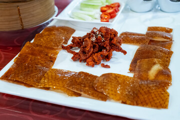 Delicious Plate of Peking Duck with Side Accompaniments