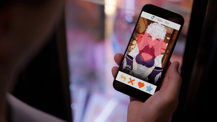 Person like an anime girl on waifu dating app smartphone over shoulder view