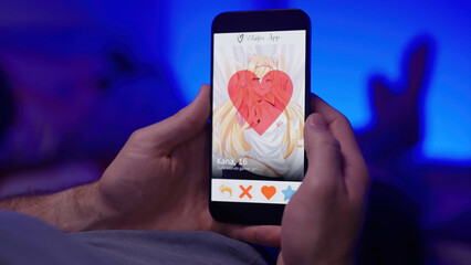 Person like an anime girl on waifu dating app smartphone over shoulder view laying on bed