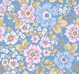 Vintage seamless floral pattern. Liberty style background of small pastel colorful flowers. Small flowers scattered over a blue background. Stock vector for printing on surfaces. Realistic flowers.
