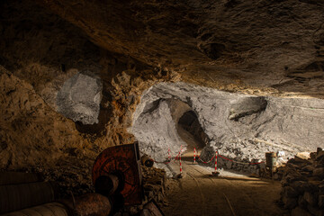 Interior of the Dossena mine with colored stones for an artistic installation.