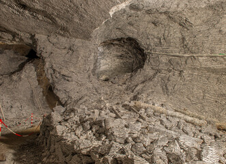 Interior of the Dossena mine with colored stones for an artistic installation.
