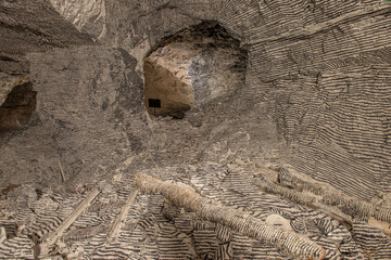 Interior of the Dossena mine with colored stones for an artistic installation.