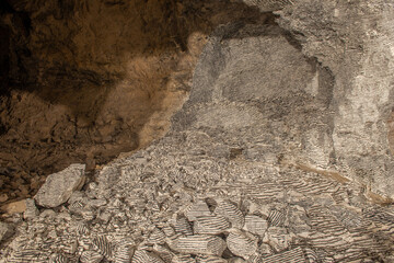 Interior of the Dossena mine with colored stones for an artistic installation.