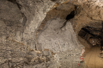 Interior of the Dossena mine with colored stones for an artistic installation.