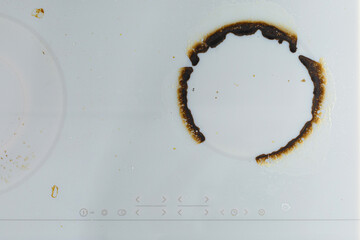 Dirty white ceramic kitchen stove after cooking