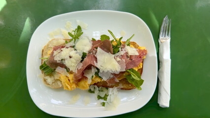 Breakefast with eggs and Prosciutto