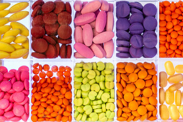 Colorful of prescription tablets and capsules pills in a medicine dose glass box. Pharmaceutical...