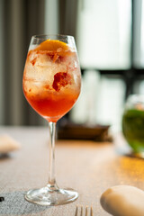 Refreshing Cocktail with Citrus Garnish on Table