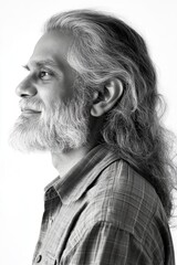 Obraz premium Conceptual art concept art of style for aging men. A happy man in a studio photo. Pure white solid background. Fashionable men's layered cut haircut - midlife indian man with long hair.