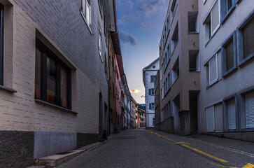 Sunset on the medieval streets in the center of Thusis in Switzerland