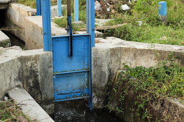 A water gate or water dam made of steel and installed in a small river.
