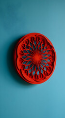 Intricate red circular design on a blue background showcasing artistry and craftsmanship