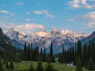 Majestic Snow-Capped Mountain Range with Pine Forest at Sunrise