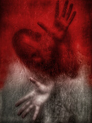 A man behind wet glass, hands pressed against it, expressing emotional pain.