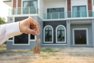 lease, rental and selling home. Real estate agent manager smile holding key for new owner. rent...