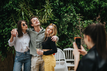 Friends having fun while posing for a photo outdoors, framed by lush green foliage. Capturing joyful and carefree moments at a casual garden gathering, emphasizing friendship and togetherness.
