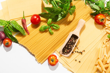 Italian Food Ingredients Pasta, Tomatoes, Basil, Garlic, and Spices