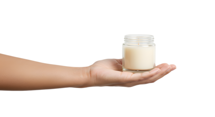 Holding small candle jar in hand for relaxation and fragrance