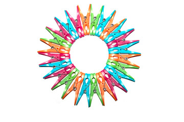 Colourful vibrant clothes pegs on a white background close up for laundry day