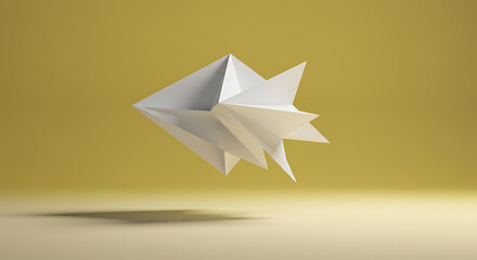 Abstract geometric origami fish sculpture floating above a reflective surface with a soft yellow background