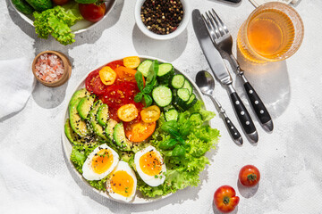 Healthy Salad Bowl with Avocado, Eggs, Tomatoes and Cucumbers, 