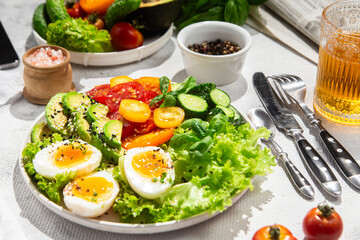 Healthy Salad Bowl with Avocado, Eggs, Tomatoes and Cucumbers, 